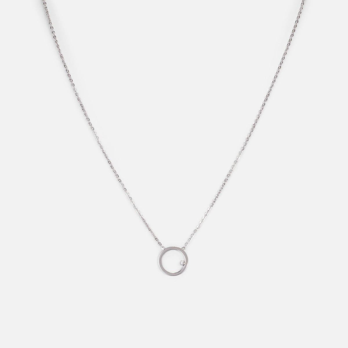 Stainless steel pendant with empty circle and small cubic zirconia stone