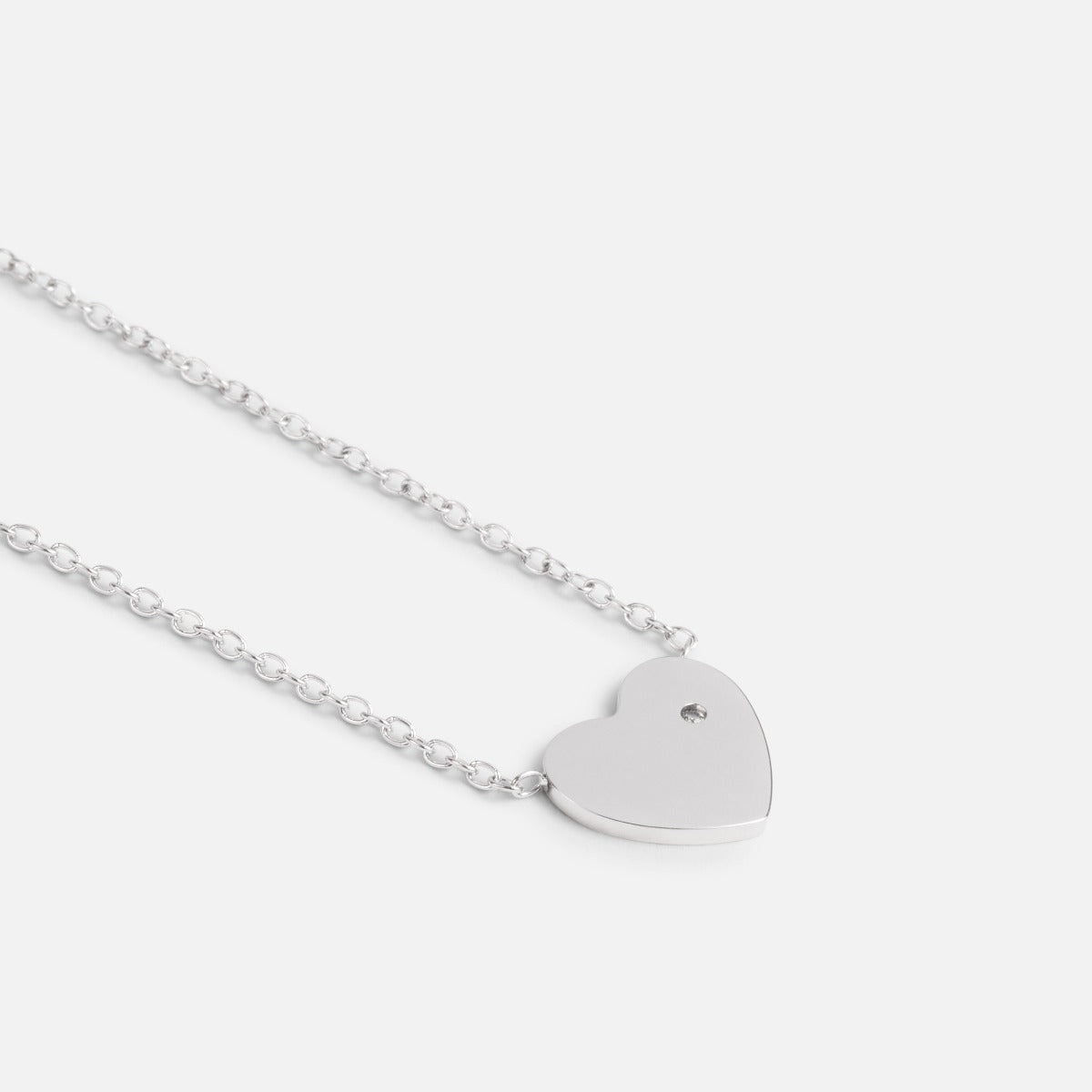 Stainless steel pendant with heart and small cubic zirconia stone