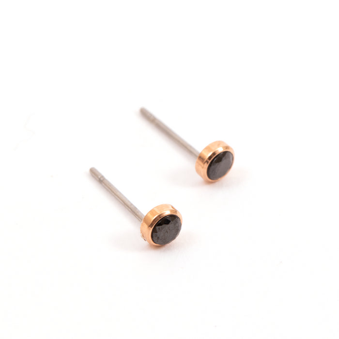 Set of two pairs of small round golden earrings