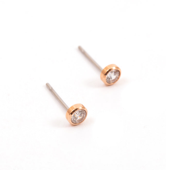 Set of two pairs of small round golden earrings