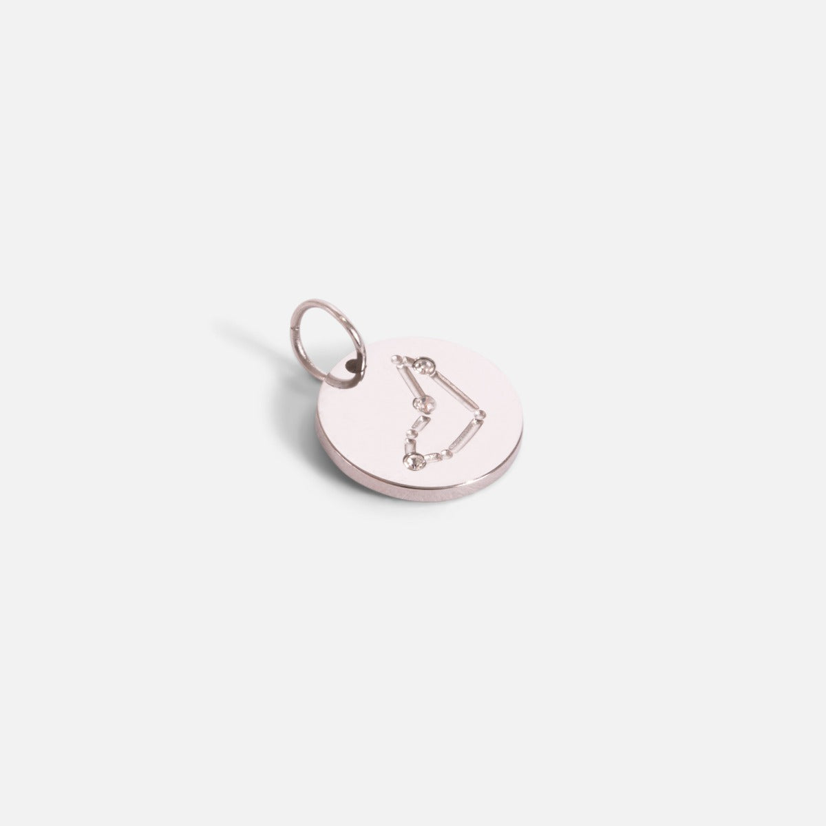 Small silvered charm engraved with the zodiac constellation "capricorn"   