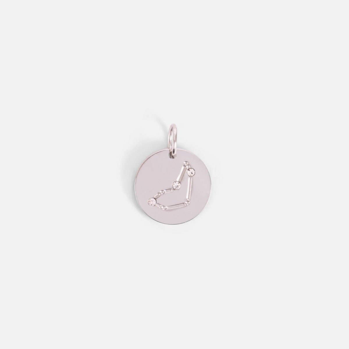 Small silvered charm engraved with the zodiac constellation "capricorn"   