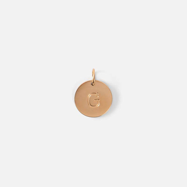 Load image into Gallery viewer, Small symbolic golden charm engraved with the letter of the alphabet &quot;g&quot;
