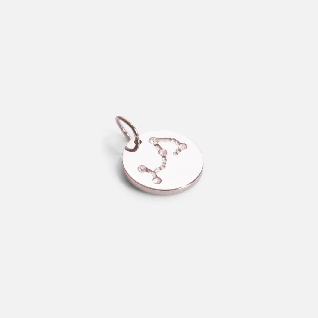 Small silvered charm engraved with the zodiac constellation 