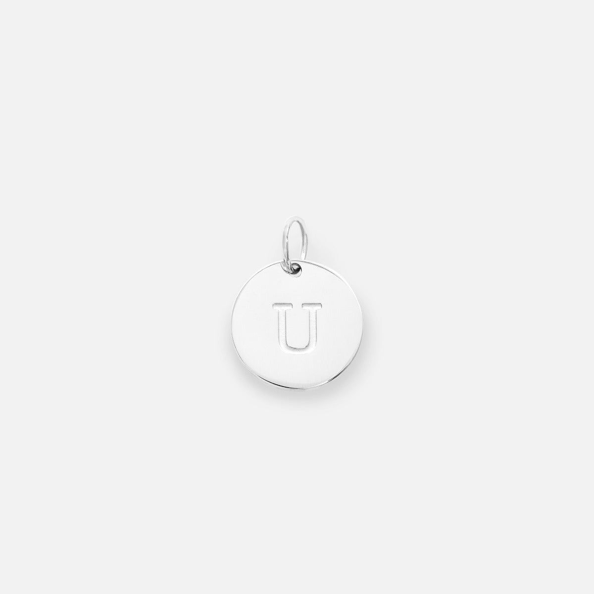 Small symbolic silvered charm engraved with the letter of the alphabet "u"