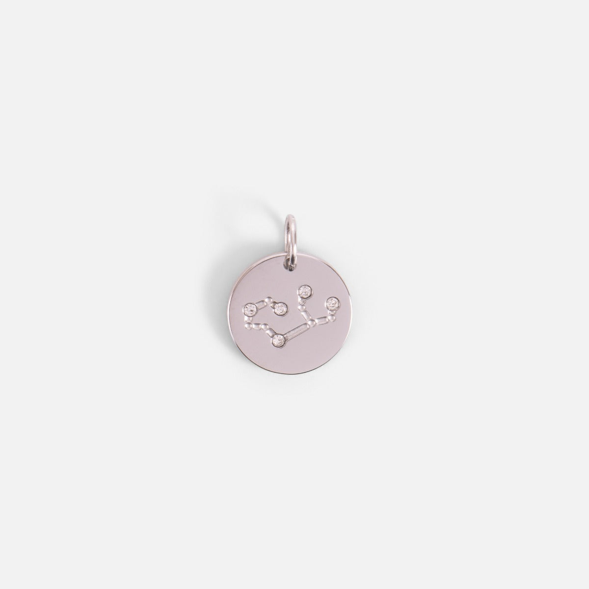 Small silvered charm engraved with the zodiac constellation "virgo"