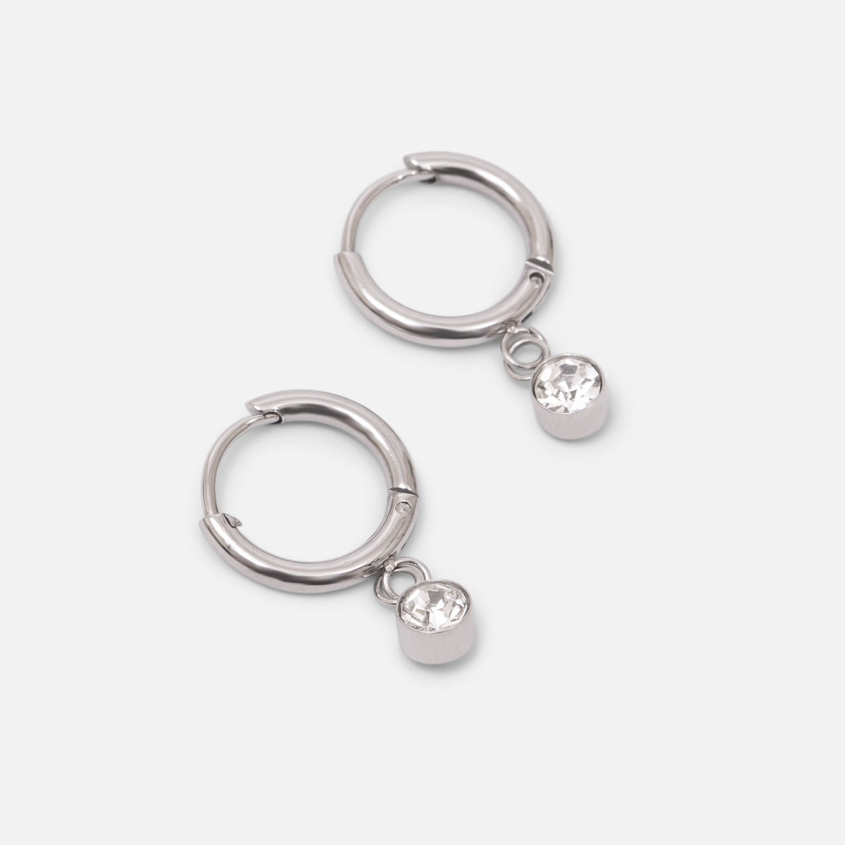 Small silver stainless steel huggies with zirconia stone