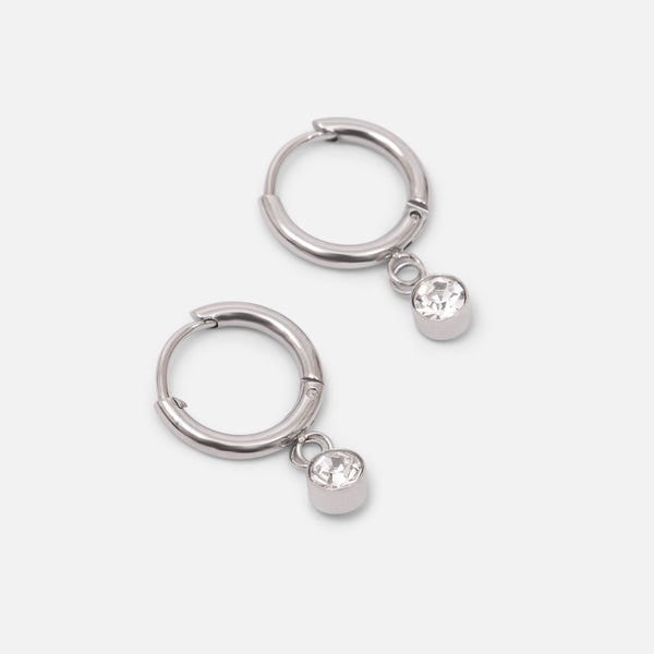 Load image into Gallery viewer, Small silver stainless steel huggies with zirconia stone

