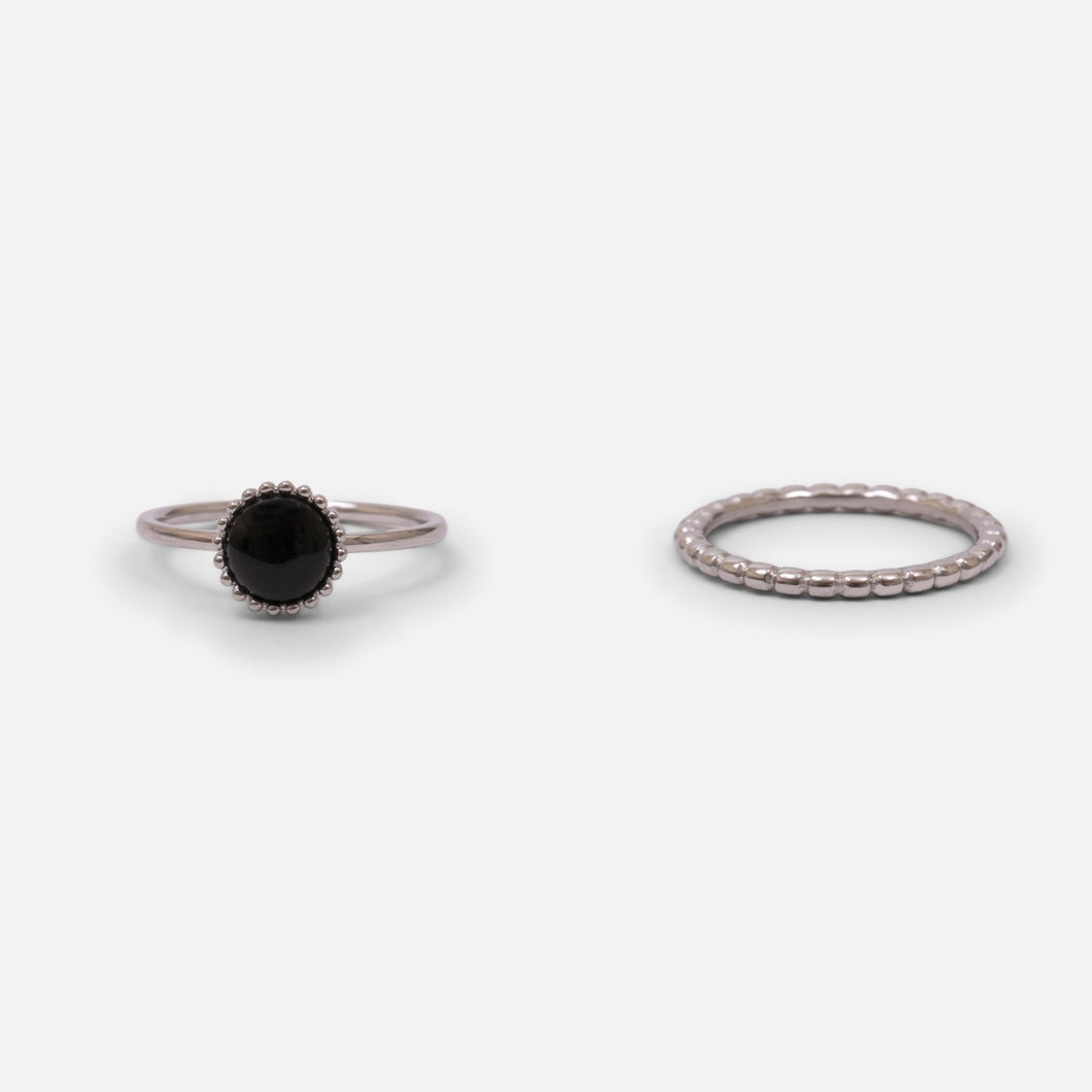 Set of two silver stainless steel rings with a black stone and silver pearls