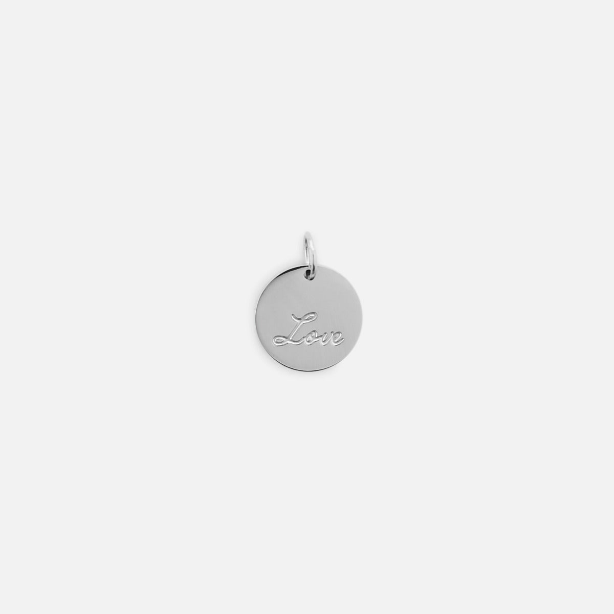 Small symbolic silvered charm engraved "love" wording 