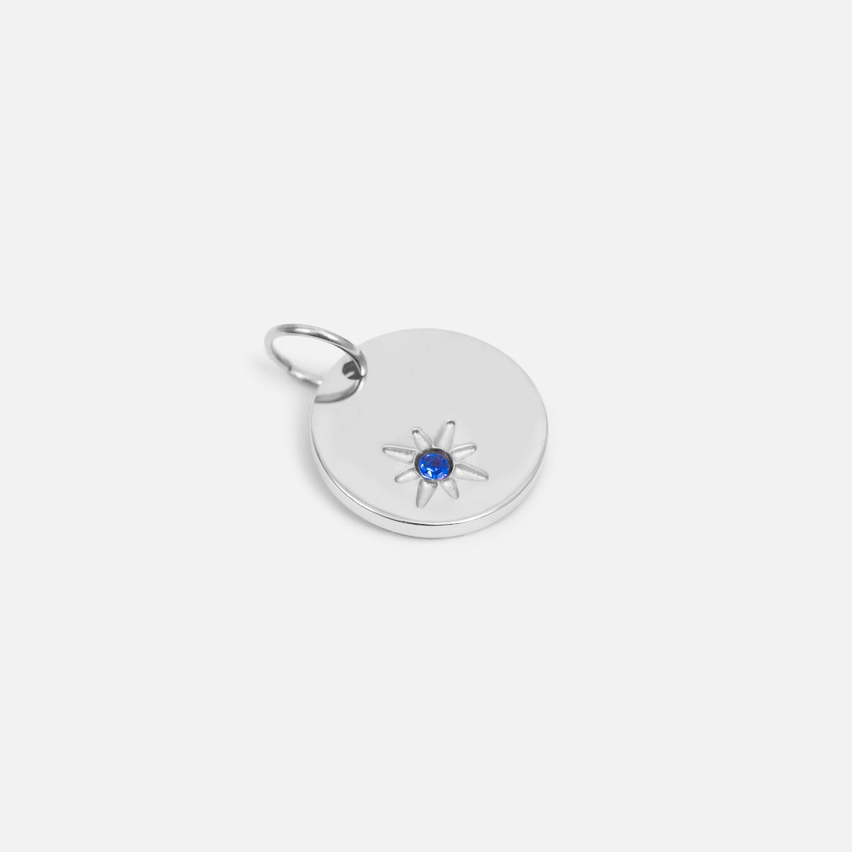 Small symbolic silvered birthstone of september " blue sapphire stone"