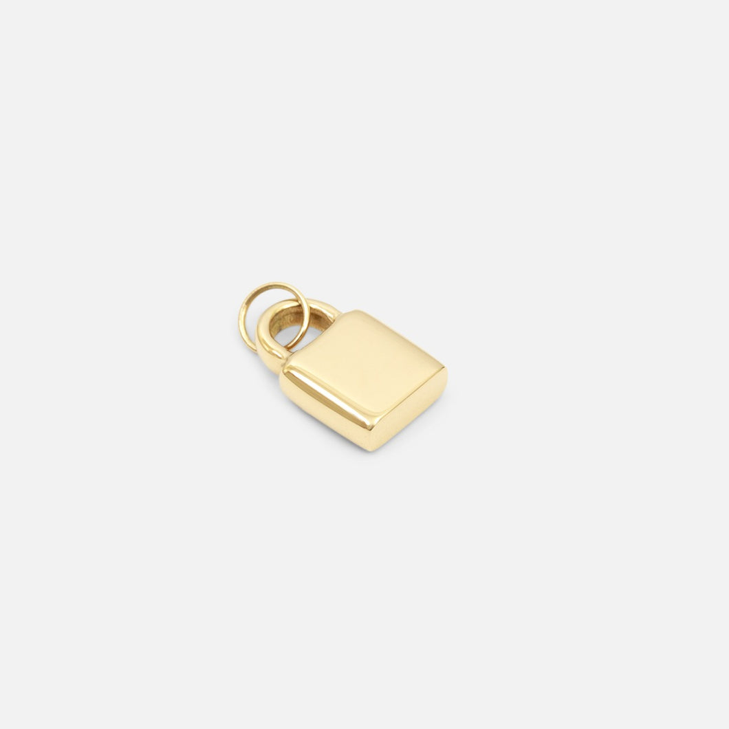 Small golden lock charm