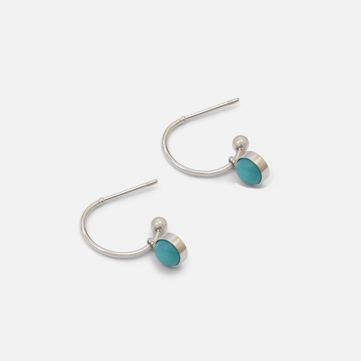 Silver stainless steel half hoop with blue stone