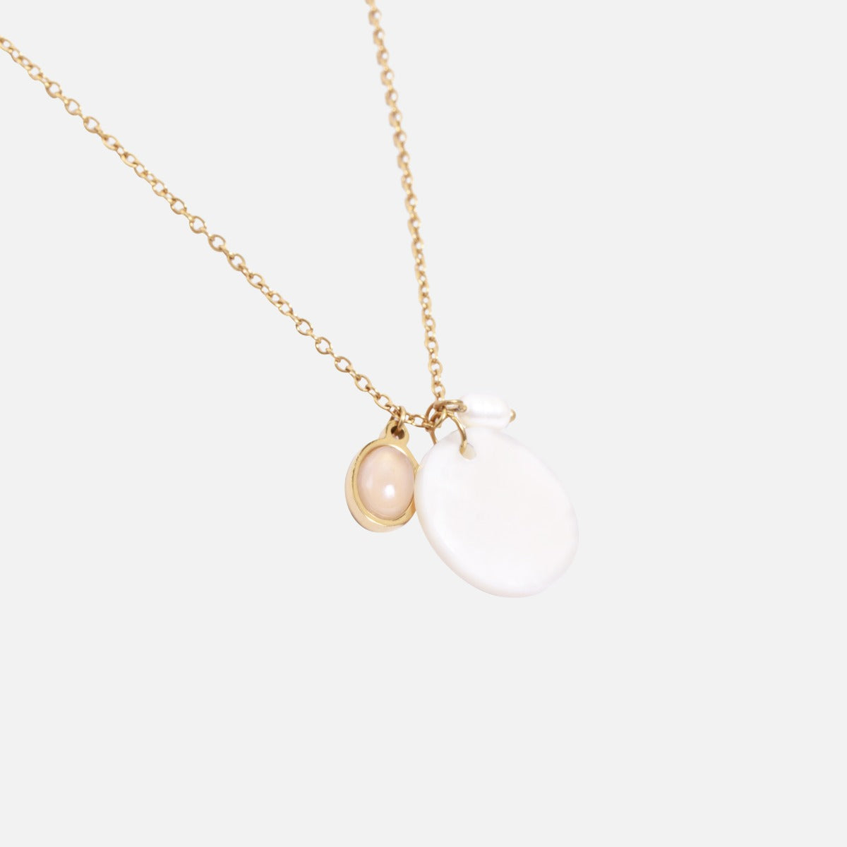 Stainless steel golden pendant with round and oval stone and pearl charm