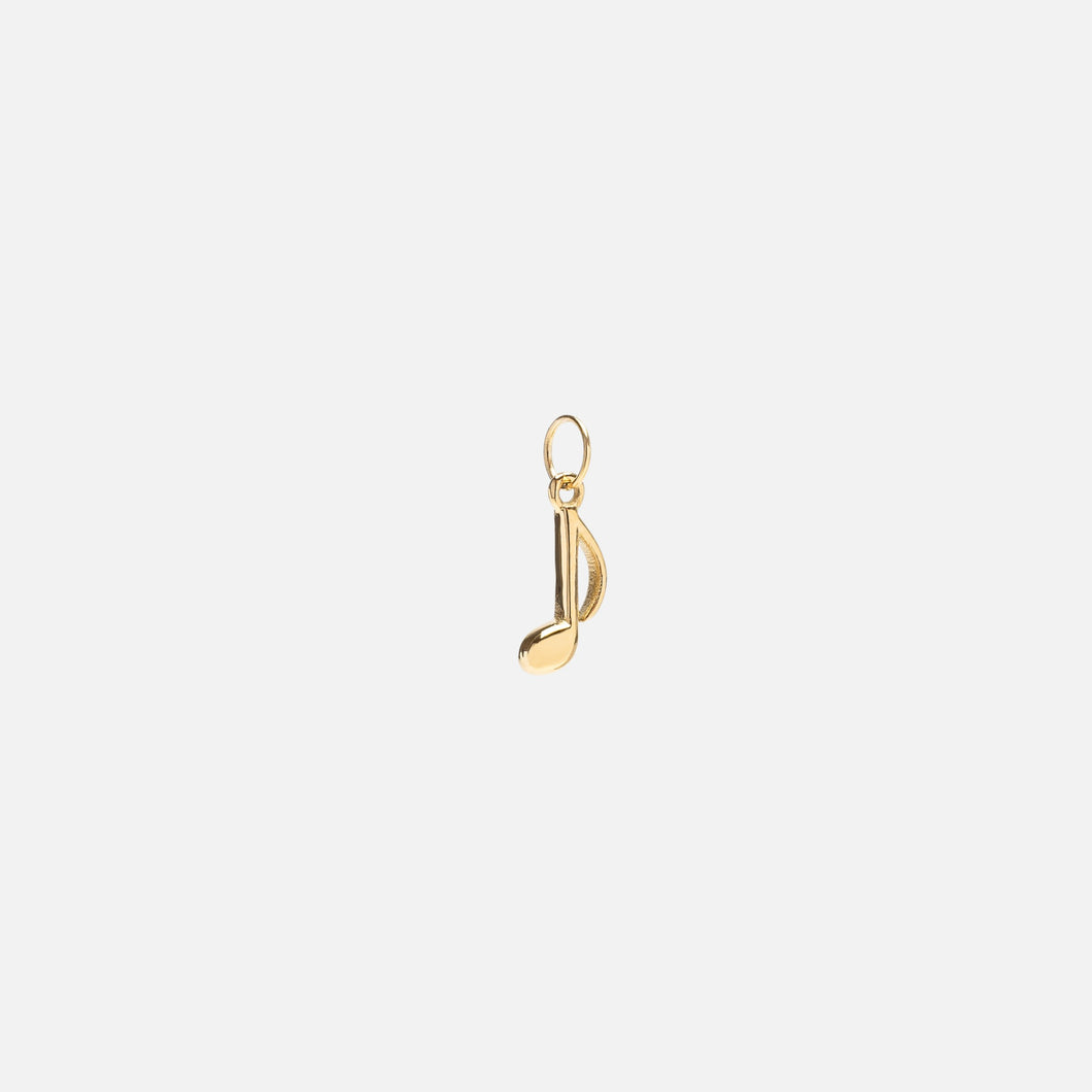 Small golden music note charm