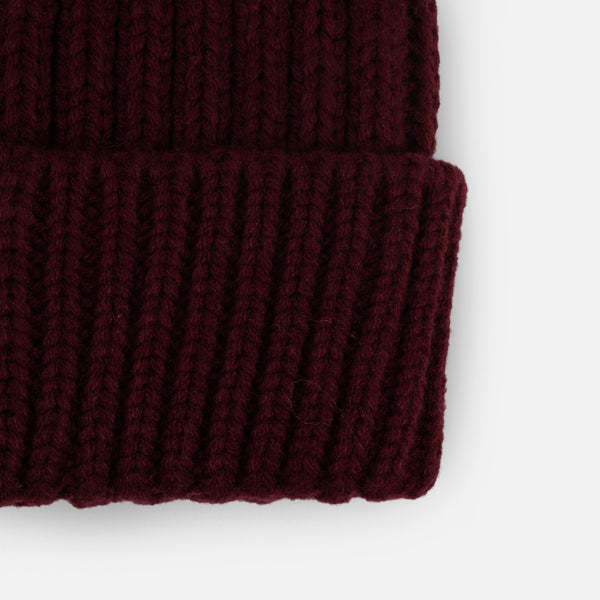 Load image into Gallery viewer, Black knit beanie with removable brown pompom
