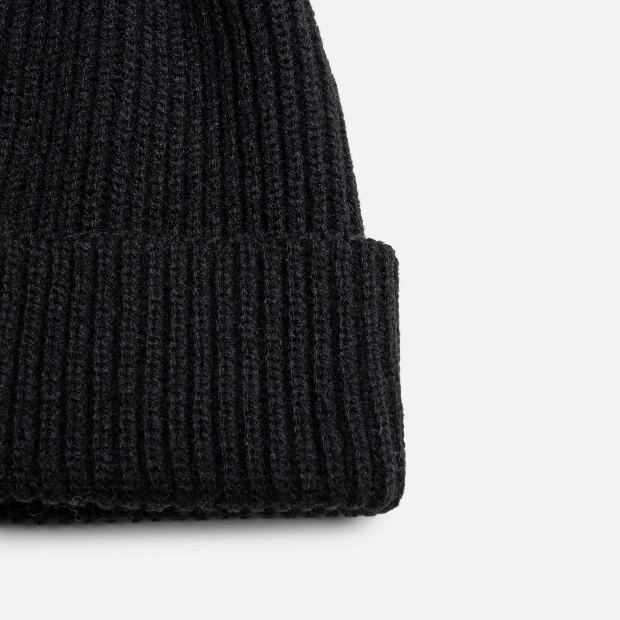 Black knit beanie with pompom