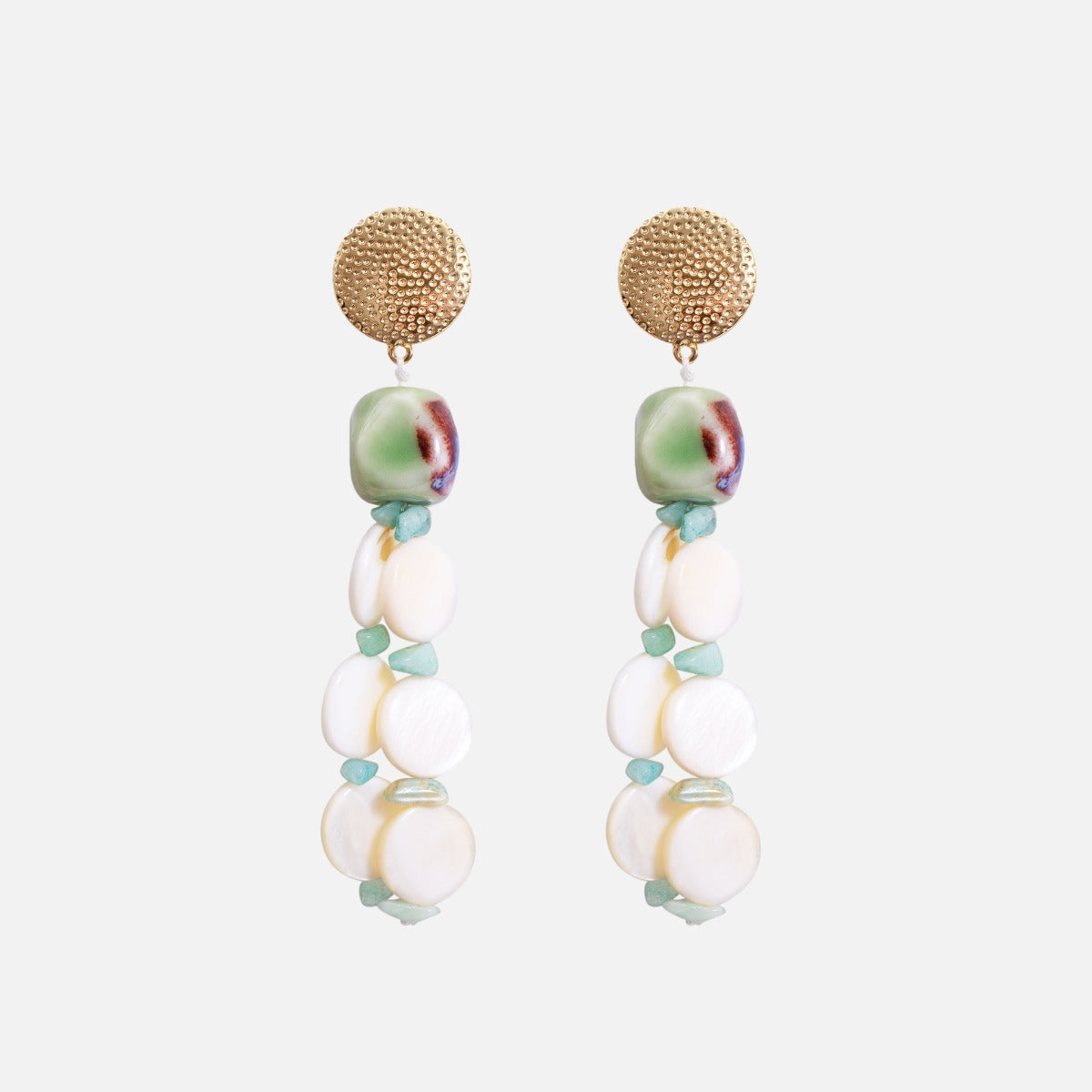 Long golden earrings with beads and pearl effect