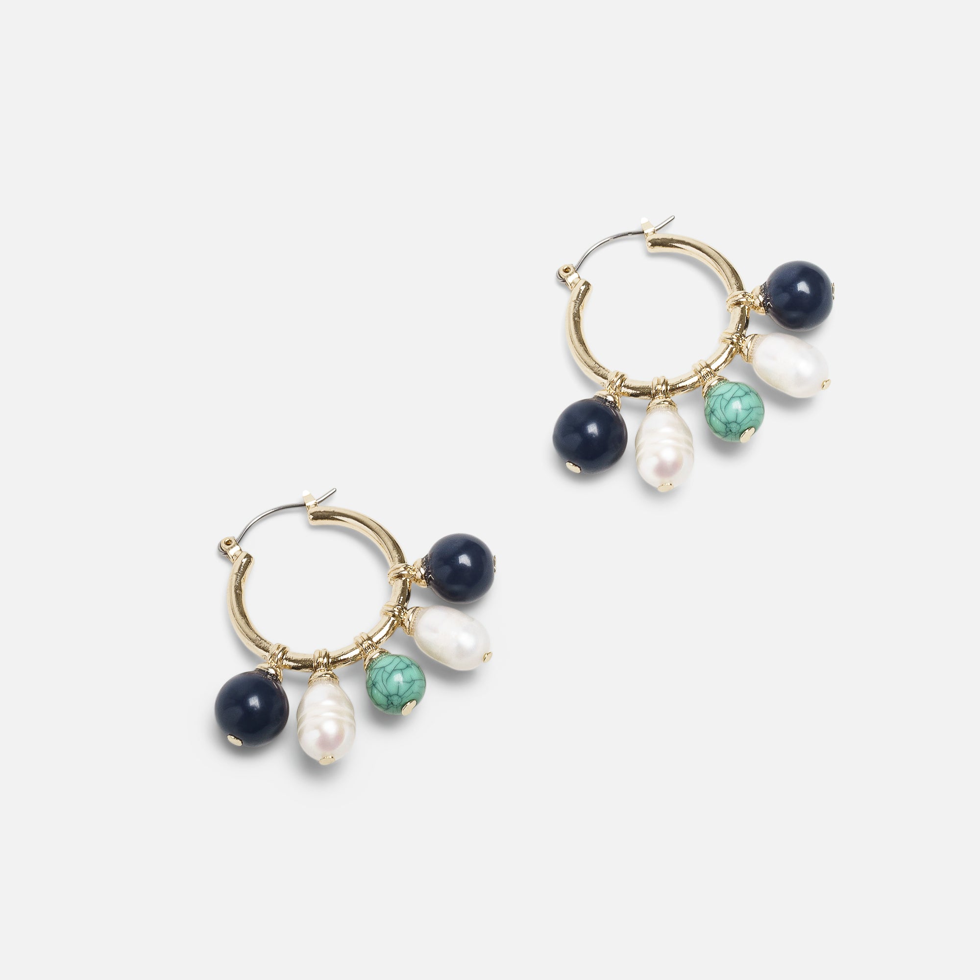 Golden hoop earrings with blue, green and white beads 