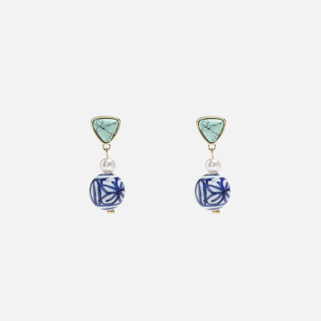 Green earrings with blue charms