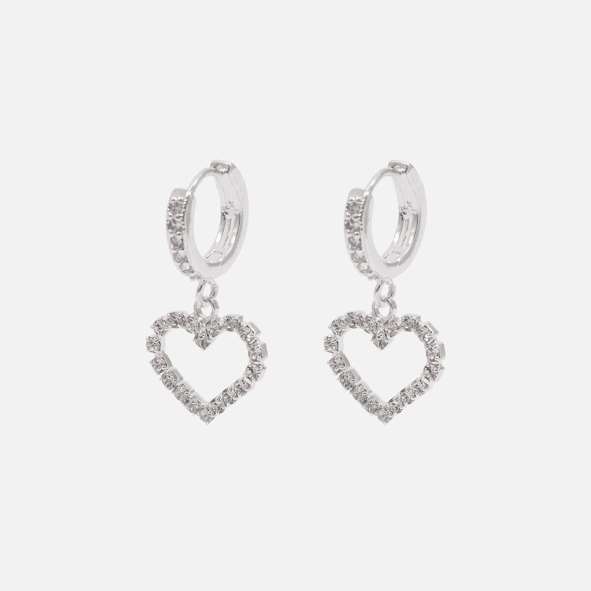 Silvered hoop earrings with sparkling stones and a heart charm