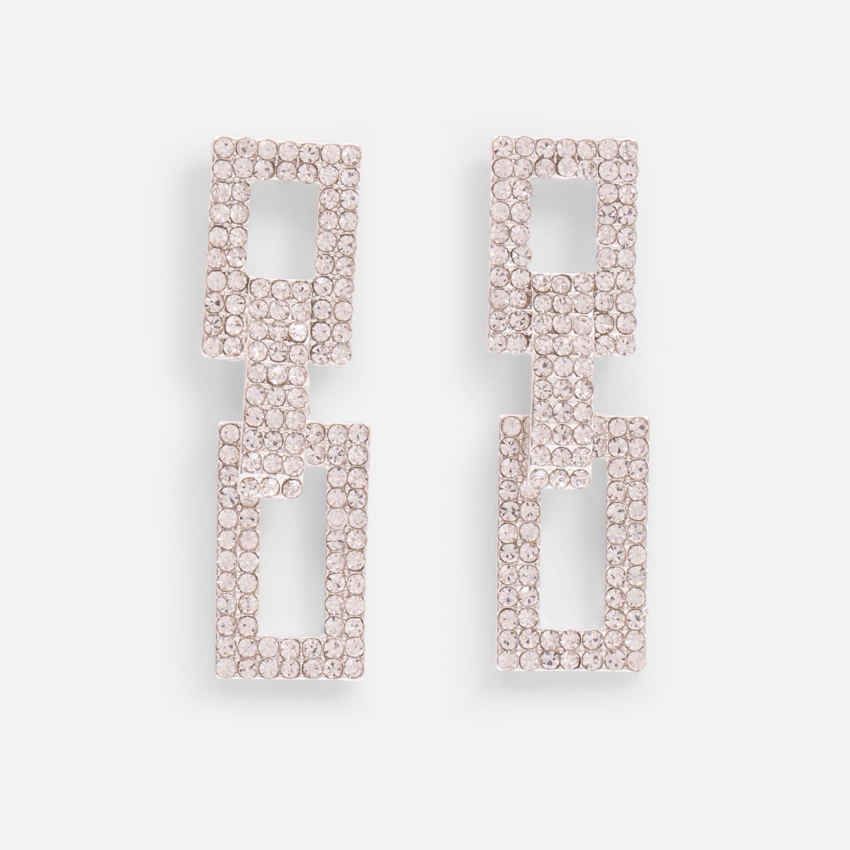 Long silvered earrings with two rectangular sparkling stones